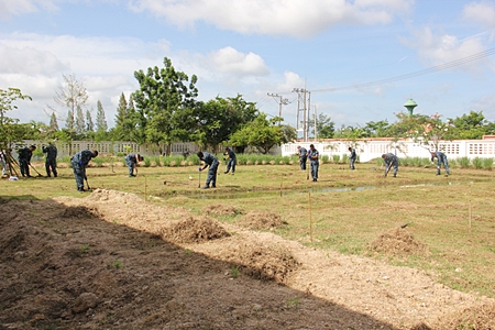 US Sailors prepare the grounds for concrete columns.